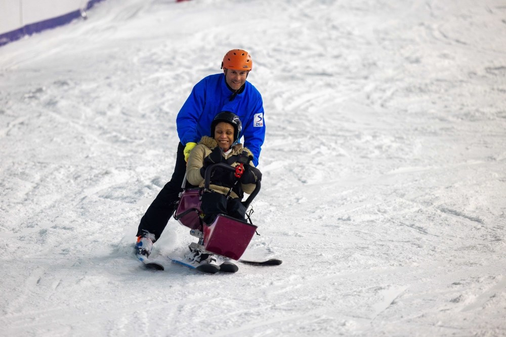 Hazel and James, her adaptive ski instructor. Photography credit: Cameron Ross Hall // Holmlands