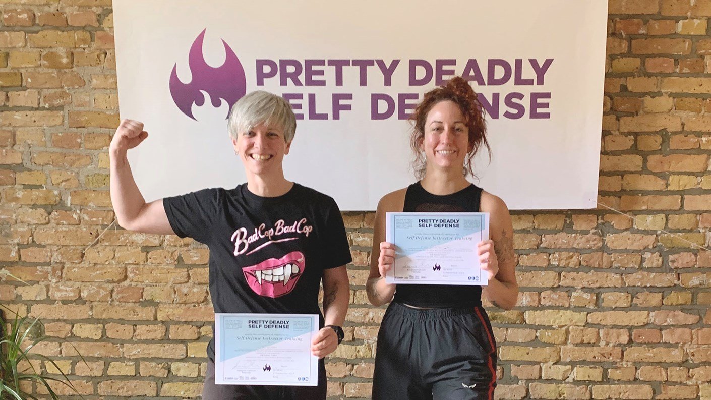 Two people holding their Pretty Deadly Self Defense certificates