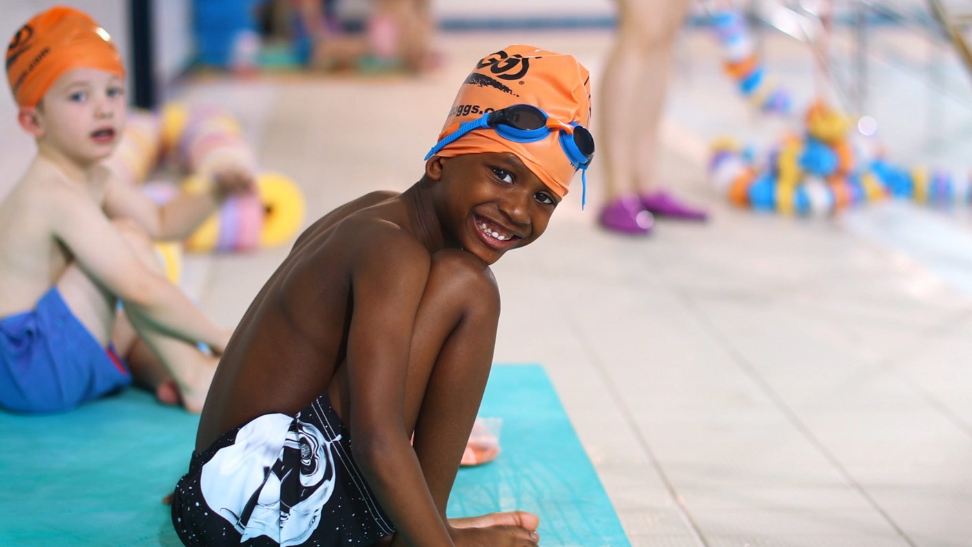 young boy at side of pool