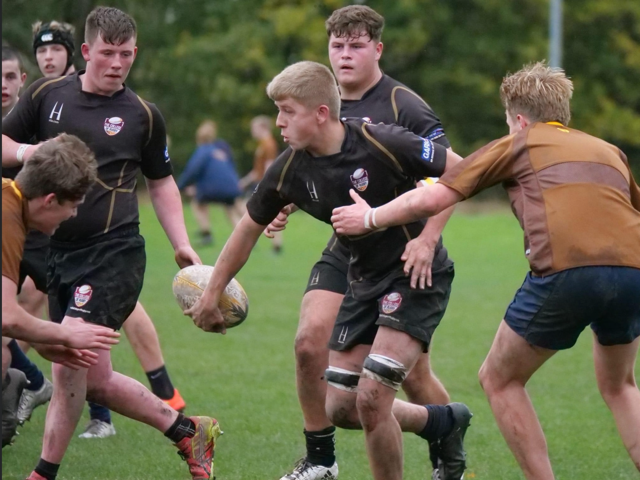 The College of Rugby students playing rugby