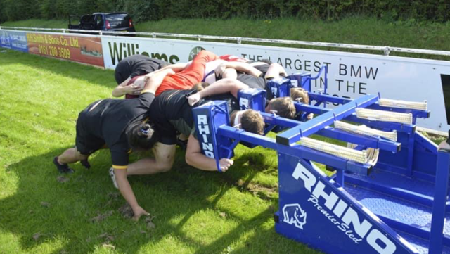 Students using a scrum machine