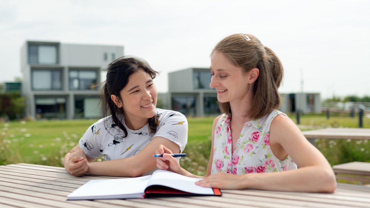 Two women working