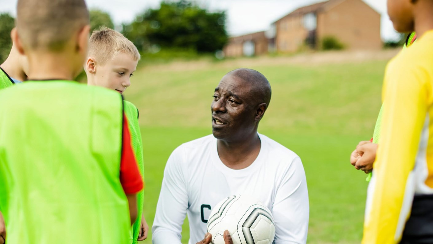 Sports coach with kids