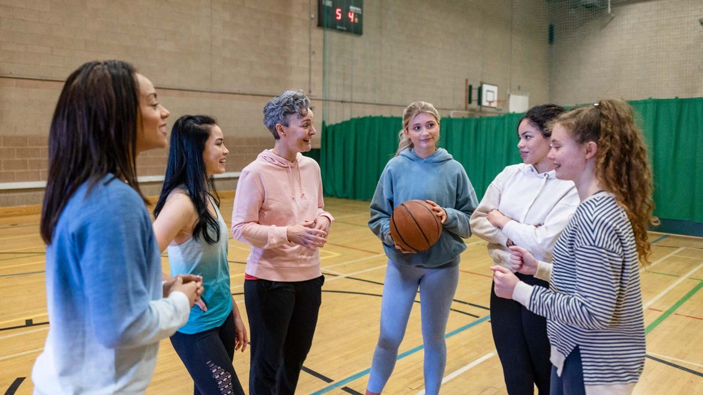 group of learners with coach