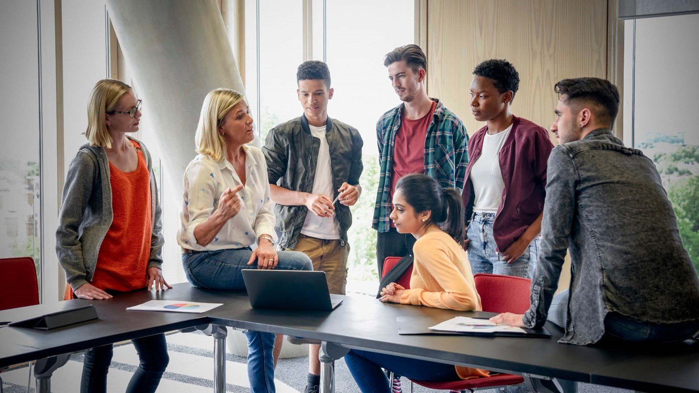 Group of university students with lecturer