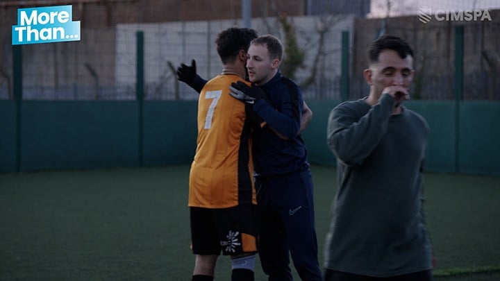 Dan coaching a football session with local youngsters and asylum seekers
