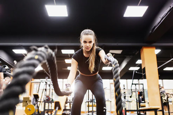 Woman doing bootcamp rope workout