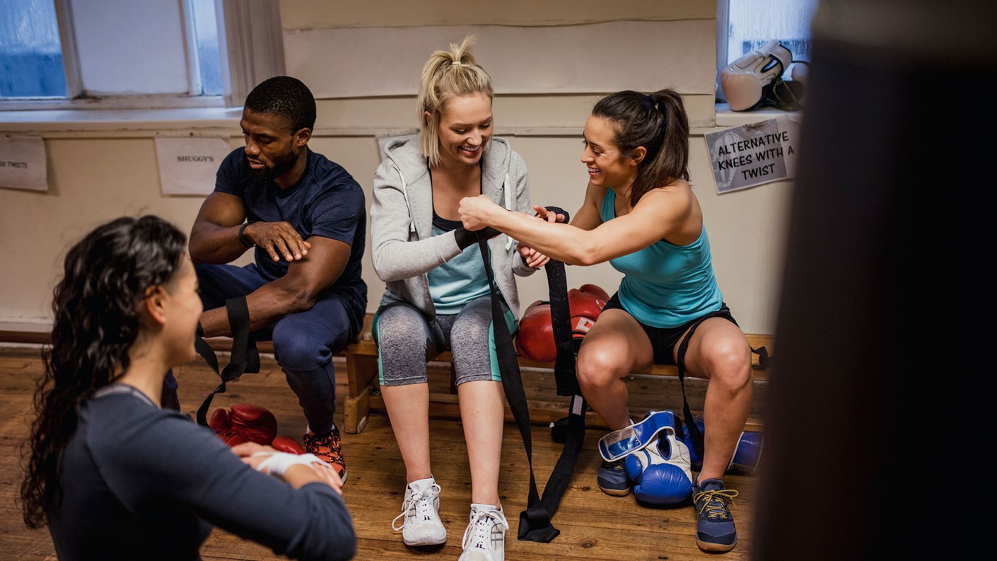 personal trainers sat prepping for class