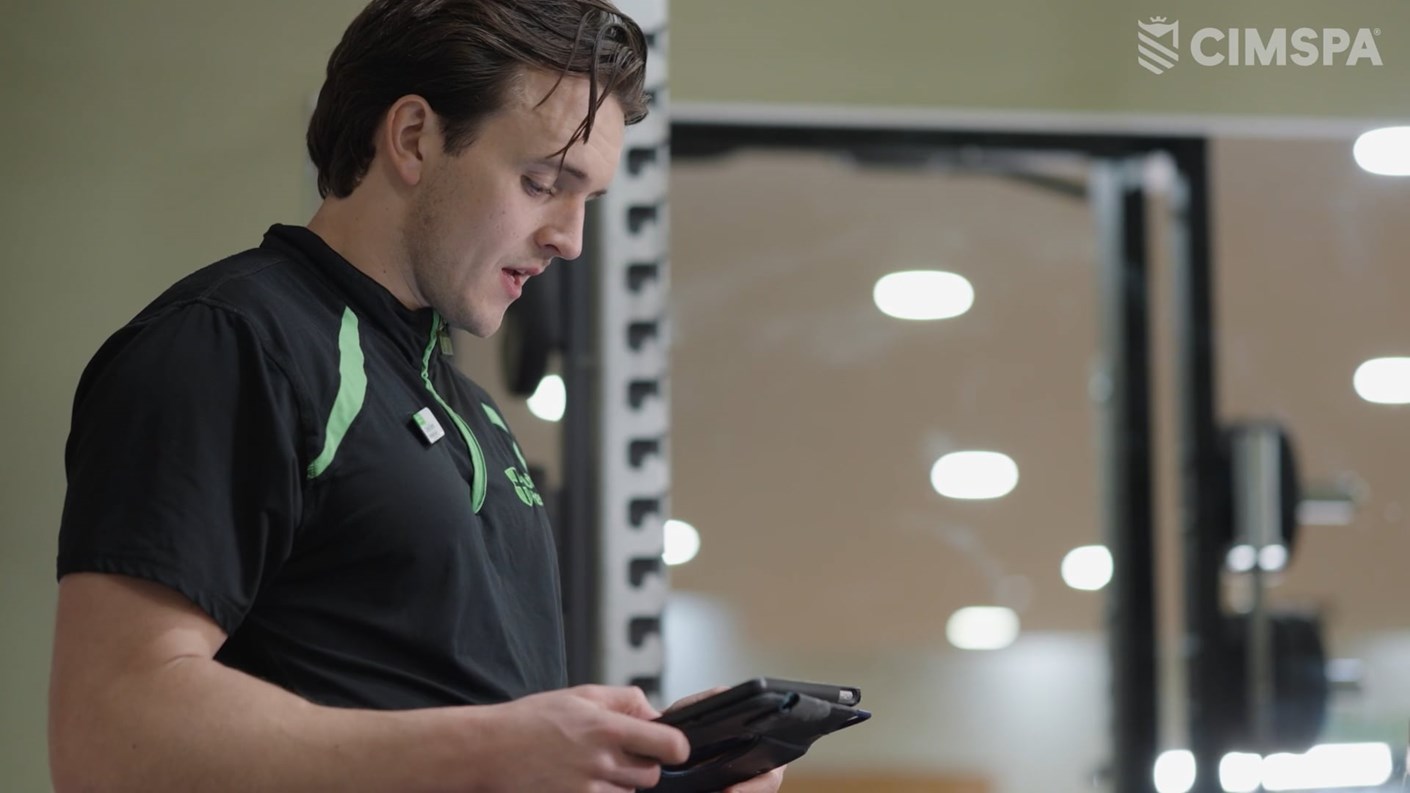 Conor O'Hanlon looking at a tablet