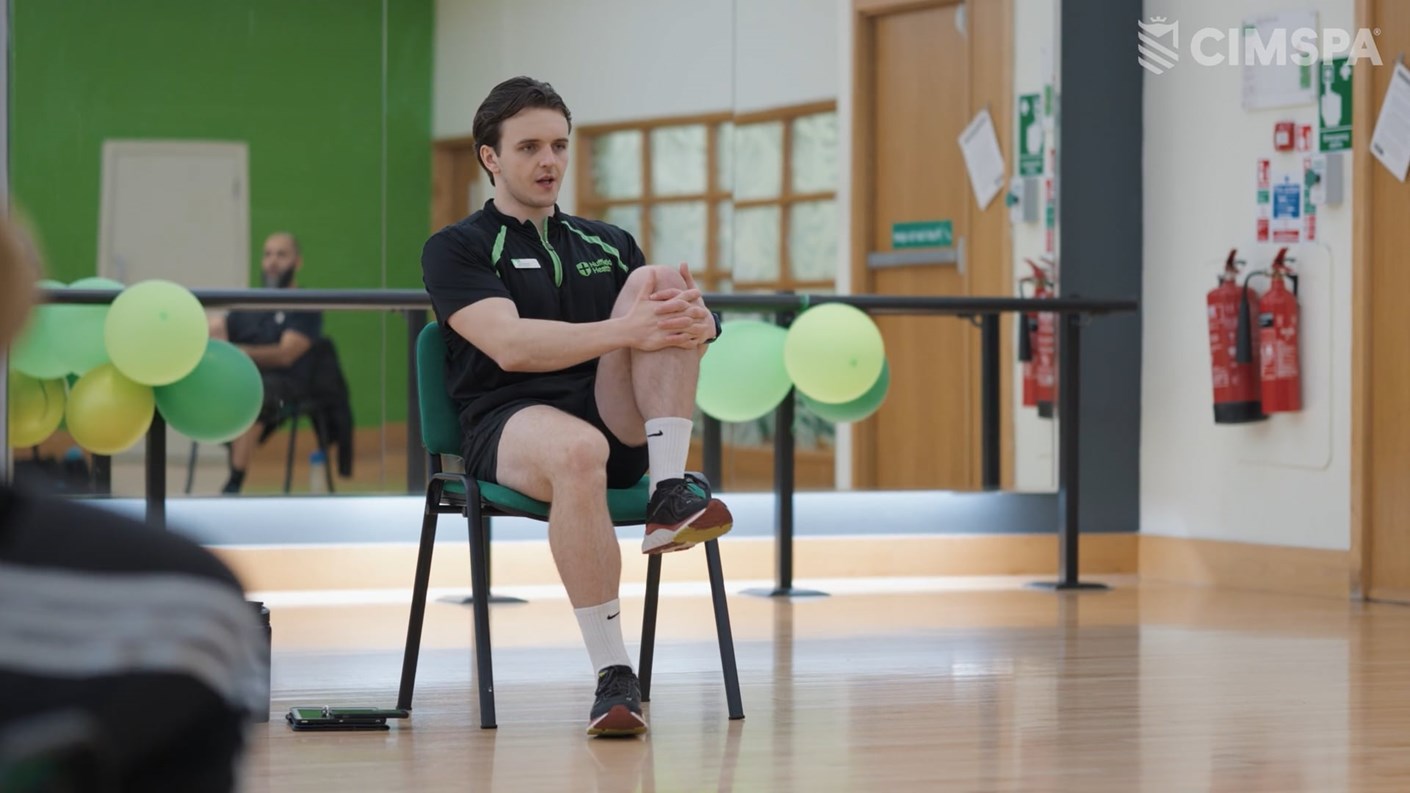 Conor O'Hanlon leading a chair-based exercise class