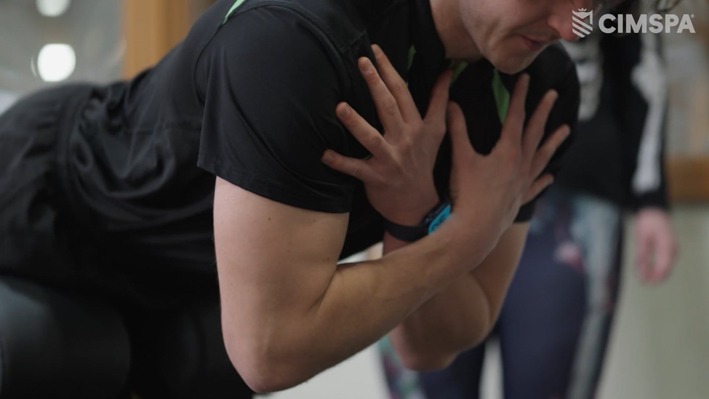 Conor O'Hanlon showcasing a stretching exercise