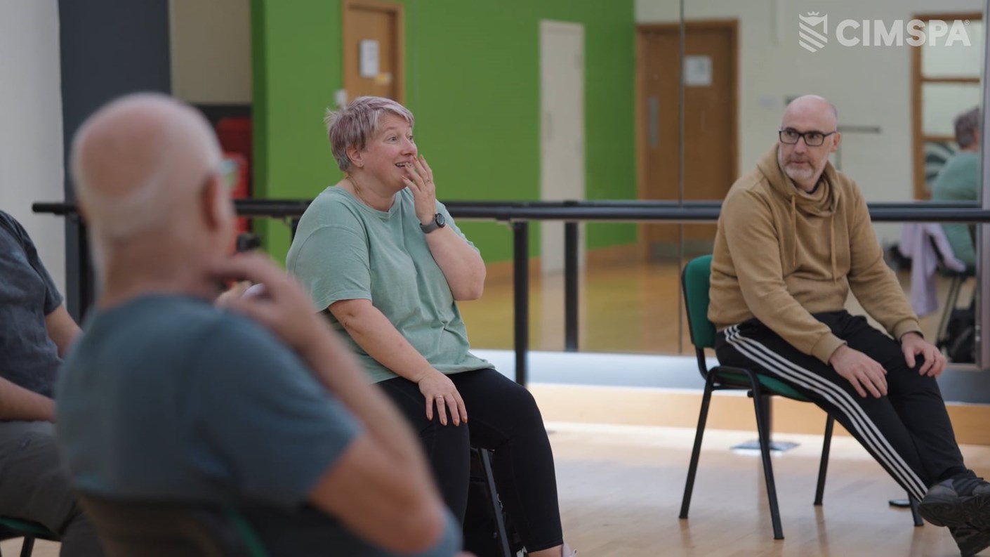 A group of people in a rehabilitation exercise class