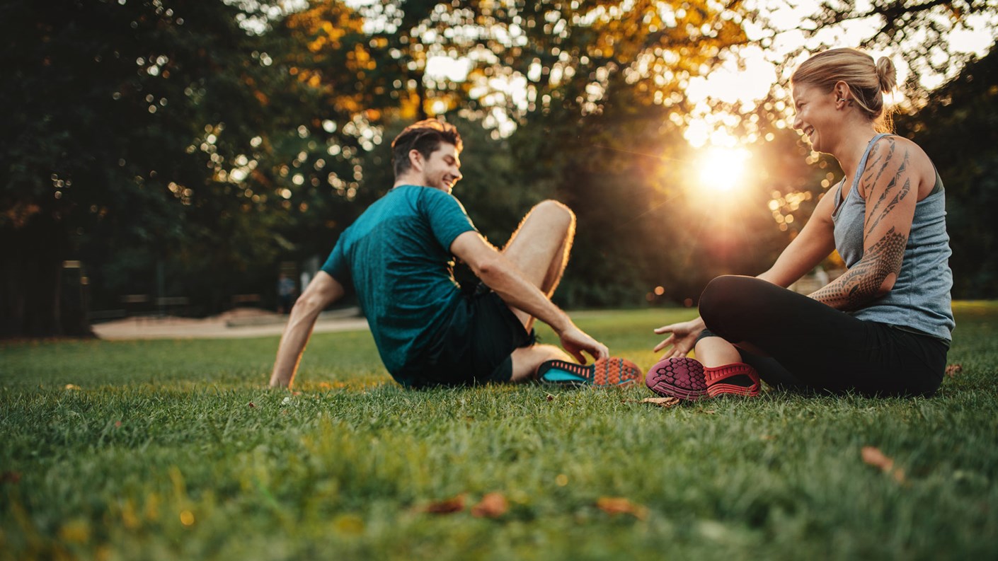 couple sat on grass