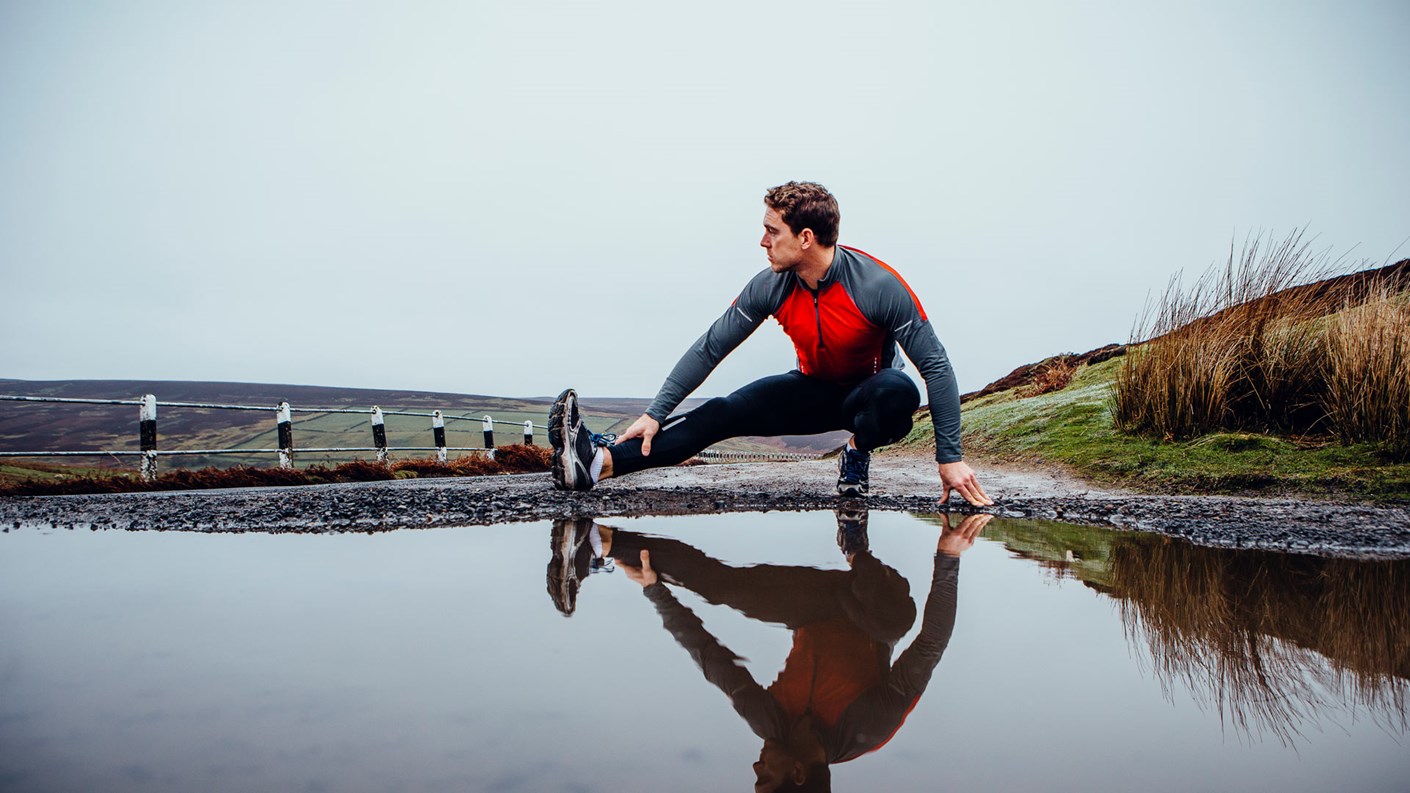 runner outside stretching