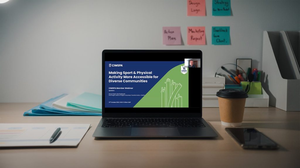 laptop open showing webinar taking place