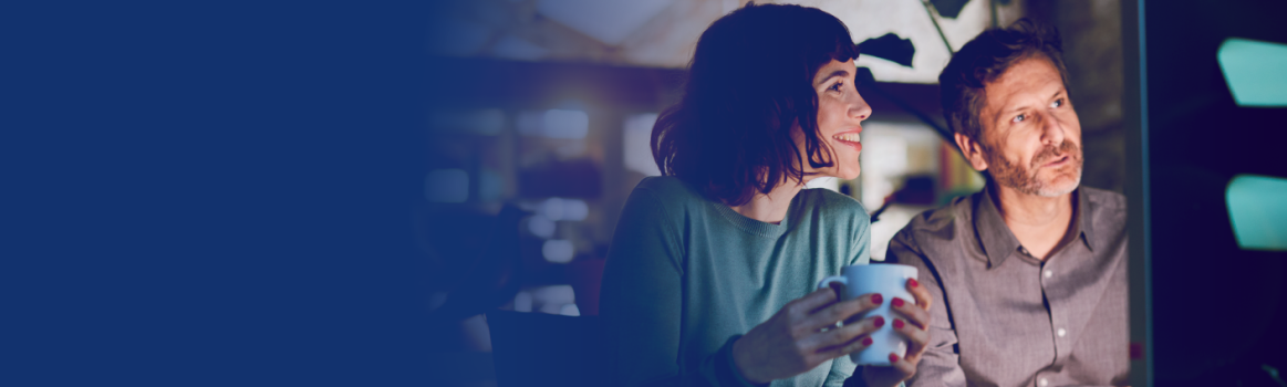 People looking at data on screen